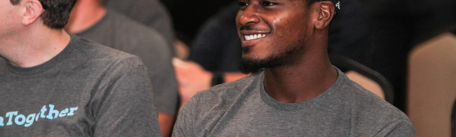 Crew member smiling at a training.