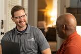 CFI and customer discussing inside of the home.