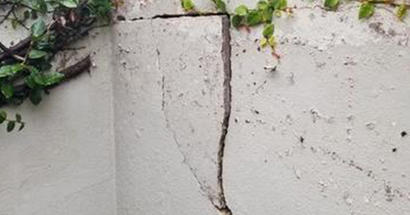 Horizontal and vertical cracks in foundation.
