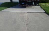 cracked and settling driveway concrete