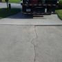 cracked and settling driveway concrete
