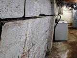 bowing and cracking basement wall