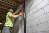 crew installing carbon fiber wall reinforcement