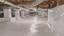 A clean, sealed crawl space with white vapor barrier sheets and ductwork visible overhead.