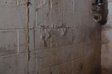 wet basement walls damaged by water