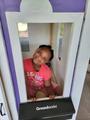 Female child smiling with Groundwork's mini mailbox