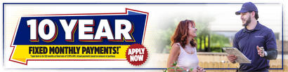 Banner reads "10 Year Fixed Monthly Payments* Apply Now" beside a woman talking to a man in a uniform holding a clipboard.