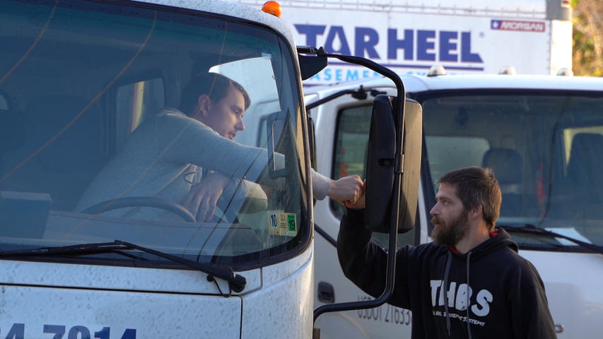 Tarheel Basement Systems crew with trucks