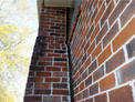 Chimney separating from home showing foundation issues