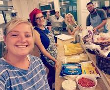 SECU Family House Enjoys Homemade Meal From Tar Heel Basement Team