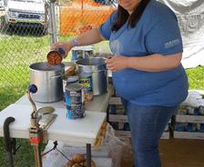 Employees Volunteer at local music festival to give back to children in need