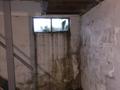 Water damage on basement window and wall