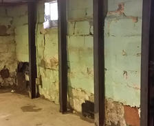 Water damage on cinderblock basement wall