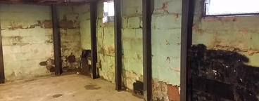 Water damage on cinderblock basement wall