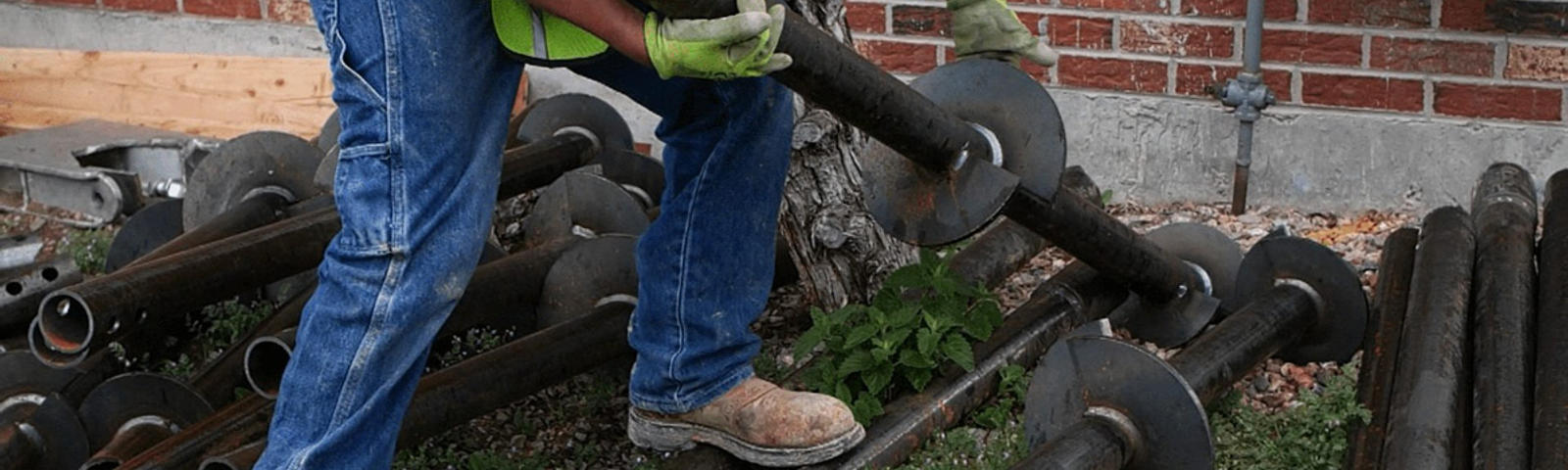 Foundation repair preparation with helical pier.