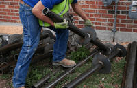 Foundation repair preparation with helical pier.