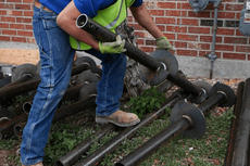 Foundation repair preparation with helical pier.