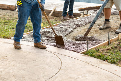 Foot shoot of poured concrete installation on the walkway.