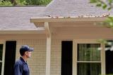man inspecting a house
