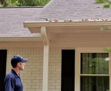 man inspecting a house