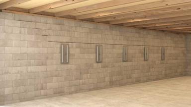 The bowing wall is being corrected with wall anchors.