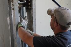 Crew installing pier system close up.