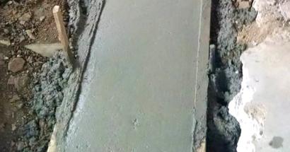Close-up of a concrete footing.