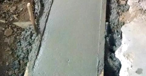 Close-up of a concrete footing.