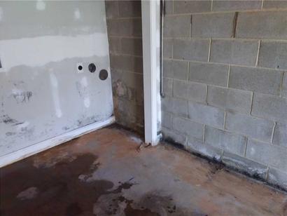 Wet floor and efflorescence interior wall.
