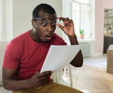 man surprised by expensive bill