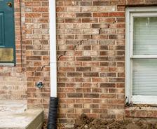 stair-step cracks in exterior brick wall