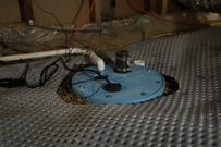 Closeup of sump pump installed in basement