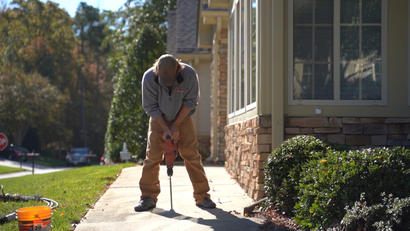 Drilling through concrete path to install PolyRenewal