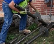CFI prepping job site for helical piers installation