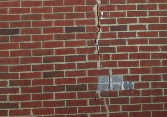 Vertical crack in brick home exterior