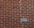 Vertical crack in brick home exterior