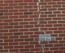 Vertical crack in brick home exterior