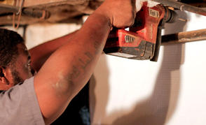 FRS crew member installing vapor barrier.
