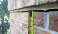 Exterior crack in brick home.
