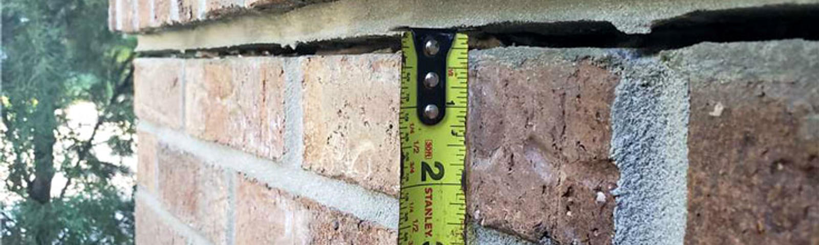 Exterior crack in brick home.
