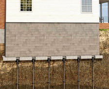 Helical piers stabilizing home's foundation