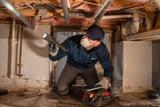 FRS inspector evaluating a crawl space