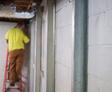 crew member installing basement wall braces