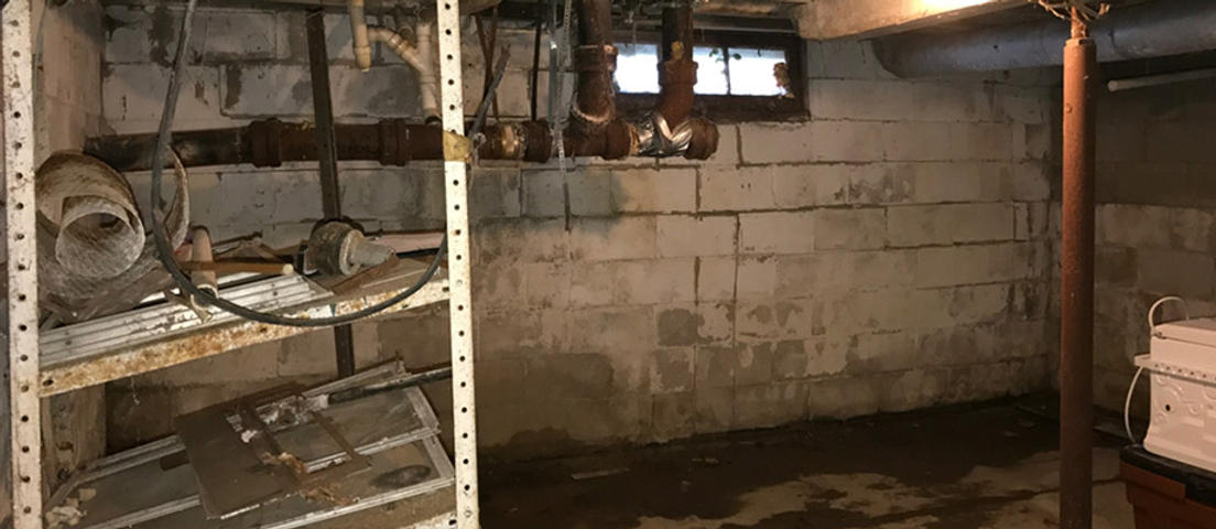 Wet basement before FRS waterproofing services