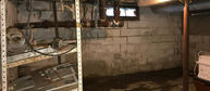 Wet basement before FRS waterproofing services