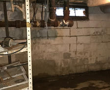 Wet basement before FRS waterproofing services