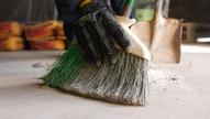 Hand sweeping with broom