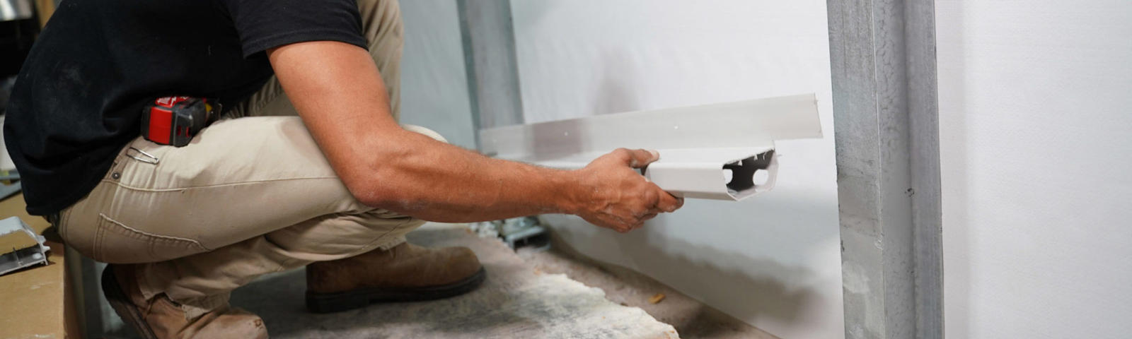 FRS Crew member installing interior drainage system