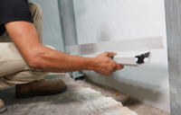 FRS Crew member installing interior drainage system