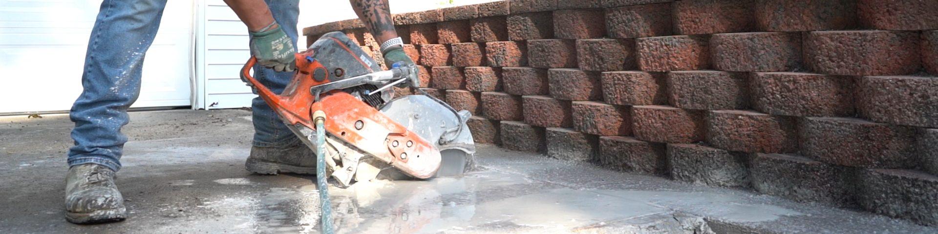FRS crew member cutting concrete.